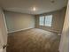 This spacious carpeted bedroom features neutral walls and windows, offering abundant natural light at 1268 Newton St, Avon, IN 46123