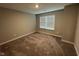 Bedroom with neutral carpet and a window that allows plenty of light at 1268 Newton St, Avon, IN 46123