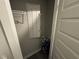 A closet features white doors, shelving, and an electrical panel on the back wall at 1268 Newton St, Avon, IN 46123