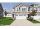 Charming townhome with a two-car garage, neatly landscaped yard, and a welcoming entrance at 1268 Newton St, Avon, IN 46123