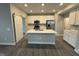 Modern kitchen featuring white cabinets, stainless steel appliances, and a large island at 1268 Newton St, Avon, IN 46123