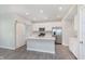 Spacious kitchen featuring white cabinets, stainless steel appliances, and a large center island at 1268 Newton St, Avon, IN 46123