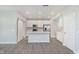 Spacious kitchen with a large island, stainless steel appliances, and a sliding barn door at 1268 Newton St, Avon, IN 46123