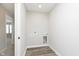 Laundry room with washer hookups, and grey wood look floors at 1268 Newton St, Avon, IN 46123