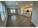 Spacious open floor plan featuring the living room and kitchen with stainless steel appliances at 1268 Newton St, Avon, IN 46123