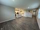 Open floor plan of living room and kitchen featuring modern appliances and hardwood floors at 1268 Newton St, Avon, IN 46123