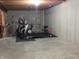 Unfinished basement area being used as an exercise room with exercise equipment at 12866 Thames Dr, Fishers, IN 46037