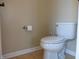 Modern toilet and tile flooring in the bathroom at 12866 Thames Dr, Fishers, IN 46037
