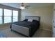 Cozy bedroom with carpet flooring, neutral walls, and a large window for natural light at 12866 Thames Dr, Fishers, IN 46037