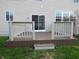 Spacious wood deck in backyard with white railings, perfect for outdoor entertaining at 12866 Thames Dr, Fishers, IN 46037