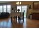 Inviting dining area with sliding glass doors, hardwood flooring, and a view to the outside at 12866 Thames Dr, Fishers, IN 46037