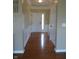 Inviting entryway featuring hardwood floors, decorative wainscoting, and a white front door with sidelight at 12866 Thames Dr, Fishers, IN 46037