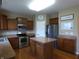 Charming kitchen boasts stainless appliances, a functional island, and plenty of cabinet space at 12866 Thames Dr, Fishers, IN 46037