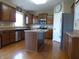 Spacious kitchen with stainless steel appliances, center island, and warm wood cabinetry at 12866 Thames Dr, Fishers, IN 46037