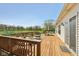 Inviting back deck with outdoor seating and a tranquil view of the pond and lush greenery at 13351 Grosbeak Ct, Carmel, IN 46033