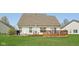 Well-kept backyard with a patio and lush green lawn, ideal for outdoor gatherings and enjoying the serene surroundings at 13351 Grosbeak Ct, Carmel, IN 46033