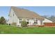 Well-maintained backyard featuring a manicured lawn and deck, perfect for enjoying the outdoors and entertaining guests at 13351 Grosbeak Ct, Carmel, IN 46033