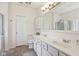 Bright bathroom with double sinks, spacious countertops, and a glass enclosed shower at 13351 Grosbeak Ct, Carmel, IN 46033