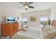 Comfortable bedroom with carpet flooring, fan, and natural light coming through the windows at 13351 Grosbeak Ct, Carmel, IN 46033