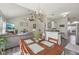 Open-concept dining room with seamless flow to living room and kitchen featuring natural light at 13351 Grosbeak Ct, Carmel, IN 46033