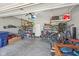 Spacious two car garage with overhead storage and a foosball table at 13351 Grosbeak Ct, Carmel, IN 46033