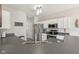 Functional kitchen featuring modern appliances, dark countertops, and white cabinetry at 13351 Grosbeak Ct, Carmel, IN 46033