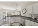 Kitchen with stainless steel appliances, countertops, and hardwood flooring with eat-in dining space at 13351 Grosbeak Ct, Carmel, IN 46033