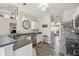 Well-lit kitchen with stainless steel appliances and hardwood flooring with eat-in dining space at 13351 Grosbeak Ct, Carmel, IN 46033