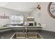 Open-concept kitchen view into the living room with vaulted ceiling and fireplace at 13351 Grosbeak Ct, Carmel, IN 46033