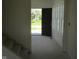 Entryway with open door and view to front yard at 1426 Redwood Dr, Crawfordsville, IN 47933