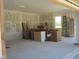 Unfinished garage with stacked materials ready for install at 1426 Redwood Dr, Crawfordsville, IN 47933