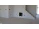 Living room view of fireplace and staircase at 1426 Redwood Dr, Crawfordsville, IN 47933