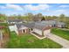Aerial view of a well-maintained brick home, with mature trees and green lawn at 1463 Rebecca Ln, Franklin, IN 46131