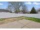 Spacious backyard featuring a well-maintained lawn, concrete patio area, and a white vinyl privacy fence at 1463 Rebecca Ln, Franklin, IN 46131