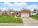 Charming single-story brick home with a well-maintained lawn and attached two-car garage at 1463 Rebecca Ln, Franklin, IN 46131