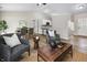 Bright open-concept living space with bar seating, dining area, and modern decor at 1463 Rebecca Ln, Franklin, IN 46131
