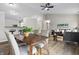 Open living and dining space with modern decor, wood floors, and plenty of natural light at 1463 Rebecca Ln, Franklin, IN 46131