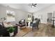Open-concept living room with modern furnishings, vaulted ceilings, and sliding glass doors at 1463 Rebecca Ln, Franklin, IN 46131