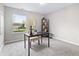 Bright office space with natural light, modern desk, and organized shelving, creating an ideal work environment at 1463 Rebecca Ln, Franklin, IN 46131