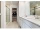 Bright bathroom with double sinks, quartz counters, walk-in shower and a walk-in closet at 15702 Cobbs Crk Ln, Noblesville, IN 46060