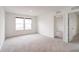 Bright bedroom featuring a large window and neutral carpeting at 15702 Cobbs Crk Ln, Noblesville, IN 46060
