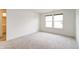 Clean, bright bedroom with neutral carpet and a view to the ensuite at 15702 Cobbs Crk Ln, Noblesville, IN 46060