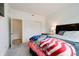 Bright bedroom featuring a comfortable bed and convenient closet access at 15702 Cobbs Crk Ln, Noblesville, IN 46060