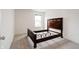 Bedroom featuring a dark wood bed frame, a window and neutral carpet at 15702 Cobbs Crk Ln, Noblesville, IN 46060