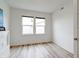 Bedroom with neutral walls, wood floors, a closet, and natural light from large windows at 15702 Cobbs Crk Ln, Noblesville, IN 46060
