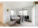 Dining room with a modern table, comfortable seating, and ample natural light at 15702 Cobbs Crk Ln, Noblesville, IN 46060