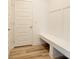 Mudroom with bench seating and coat hooks, providing convenient storage and organization at 15702 Cobbs Crk Ln, Noblesville, IN 46060