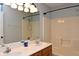 This bathroom features a large mirror over a double vanity and a shower at 16 Corkwood Ct, Brownsburg, IN 46112