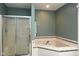 This bathroom has a large corner bathtub and a shower stall at 16 Corkwood Ct, Brownsburg, IN 46112