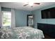 Inviting bedroom with dark wood floors, large mirror, and dark wood dresser, offering relaxation at 16 Corkwood Ct, Brownsburg, IN 46112